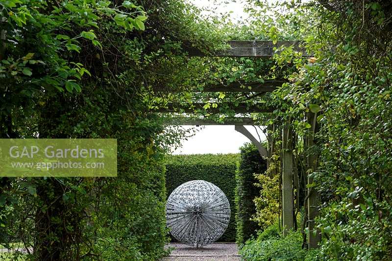 Mitton Manor, Staffordshire. stainless steel 'allium' sphere sculpture by Ruth Moilliet