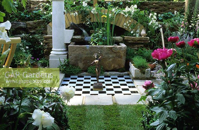 Chelsea FS 2002 Design Steven Hall Fantasy garden with statue and chequer board Peonies Iris