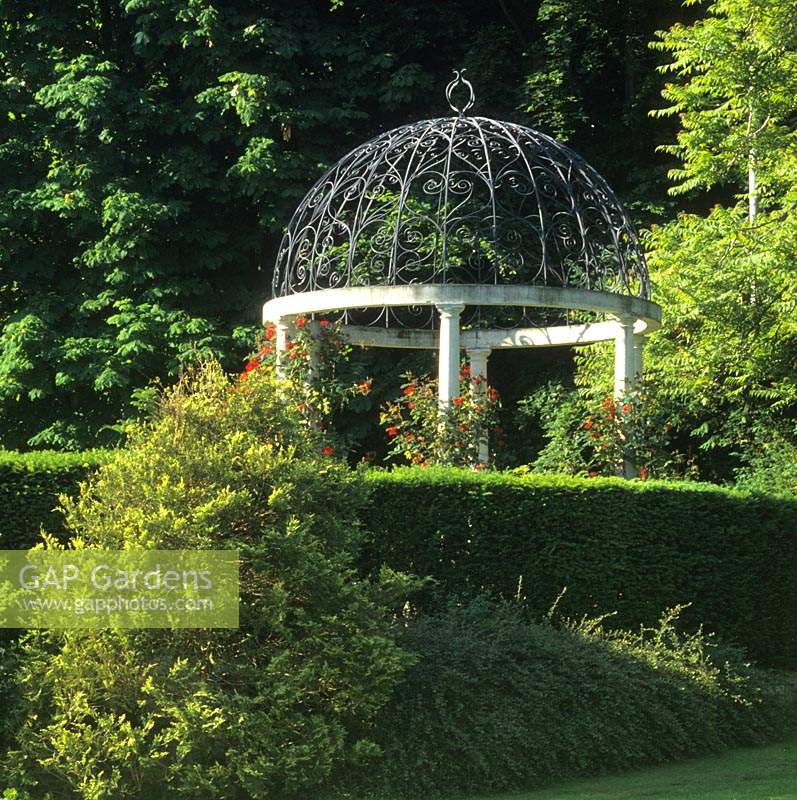 private garden Berkshire gazebo with wrought iron roof and climbing rose