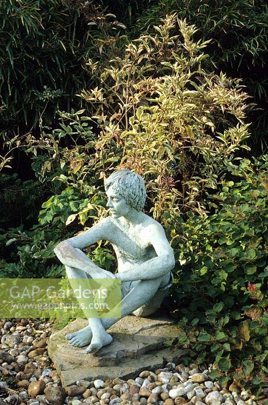 Denmans Sussex seated figurative sculpture by Marion Smith
