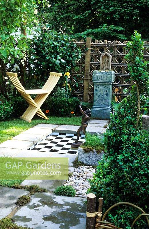 small decorative garden design Steven George Hall modern wooden seat secluded private area