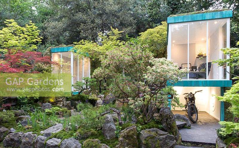 The Green Switch Garden, view of shower room and small studio space with parking underneath for motorbike in a Japanese garden with water feature, pond, boulders, Acer trees. Design: Kazuyuki Ishihara. Sponsor: G Lion