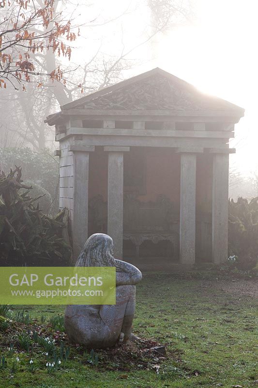 Temple and a statue 'Goddess of the Woods' in The Stumpery, Highgrove Garden, February, 2019.