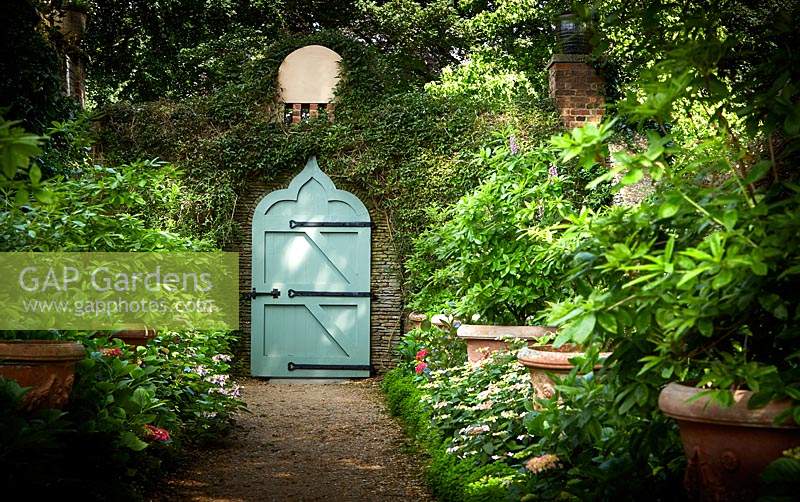 Moorish Gate in shaded Garden. The Azalea Walk, Highgrove, June, 2019. 
