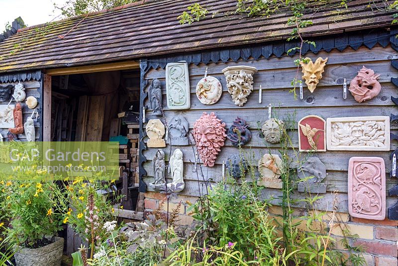 Nursery shed with plaster plaques, Hilltop garden, July.