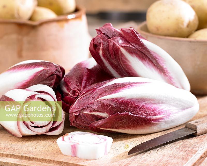 Radicchio Rosso on a kitchen chopping board with knife