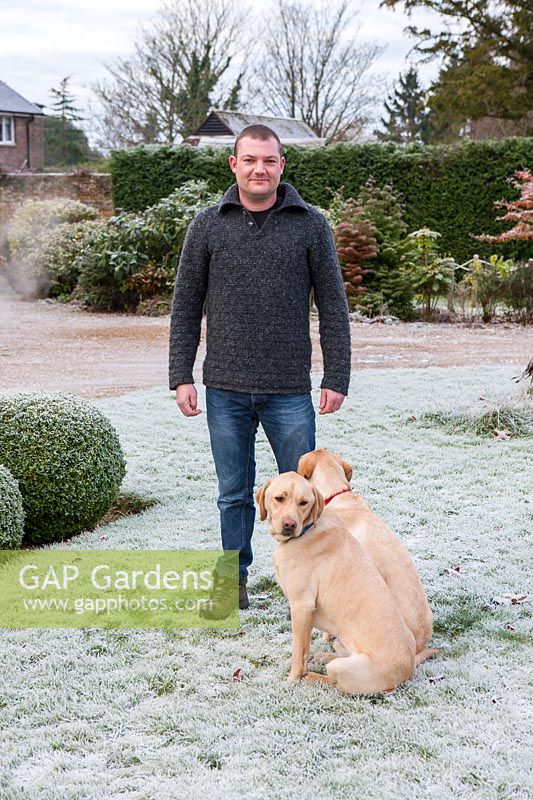 Gardener Kevin Toms with labradors, Sedgwick Park, West Sussex