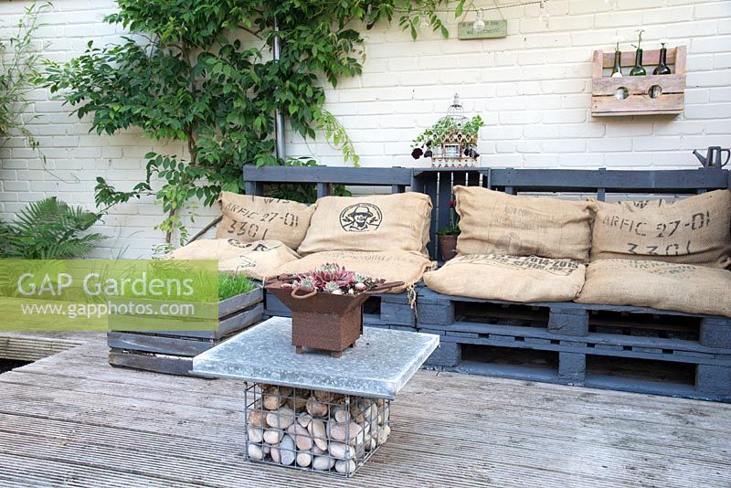 A decked seating area made with recycled materials. 