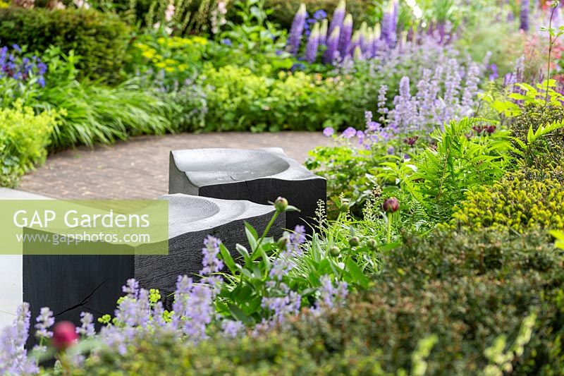 Stone seats  and mixed planting, The David Harber and Savills Garden, RHS Chelsea Flower Show, 2018 