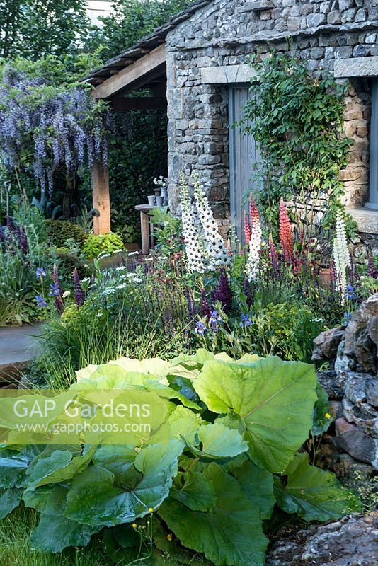 Stone cottage in show garden. Welcome to Yorkshire garden, Sponsor: Welcome to Yorkshire, RHS Chelsea Flower Show, 2018.
