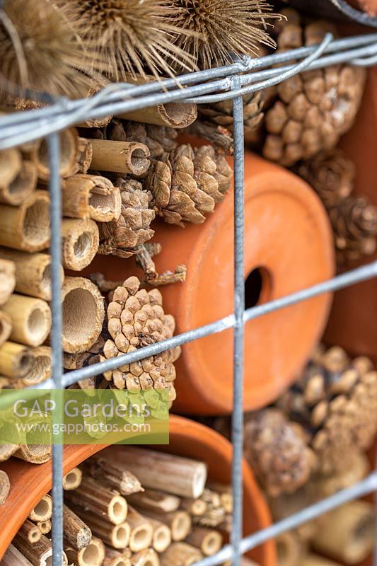 Detail of insect hotel in wire gabion