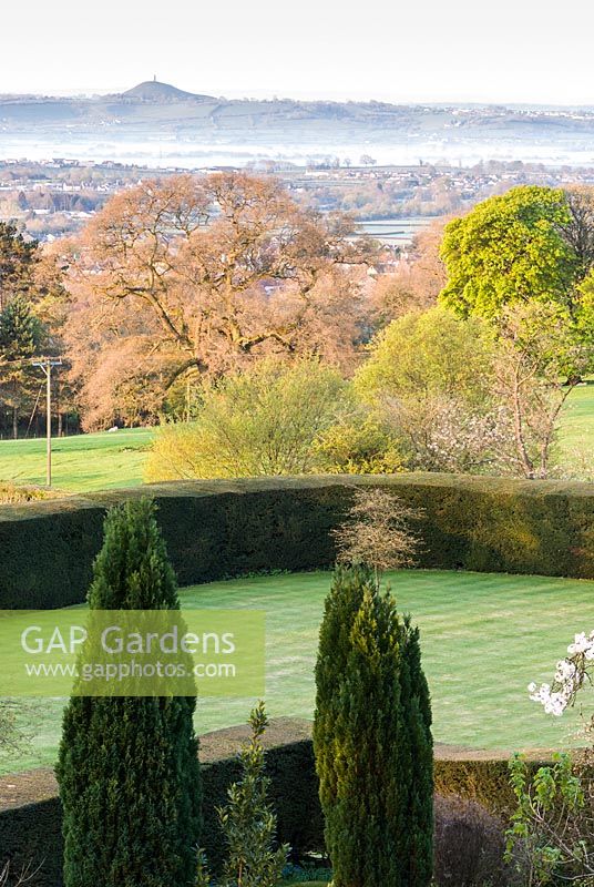Views across formal garden features such as lawns and clipped hedging to the surrounding 
countryside 
