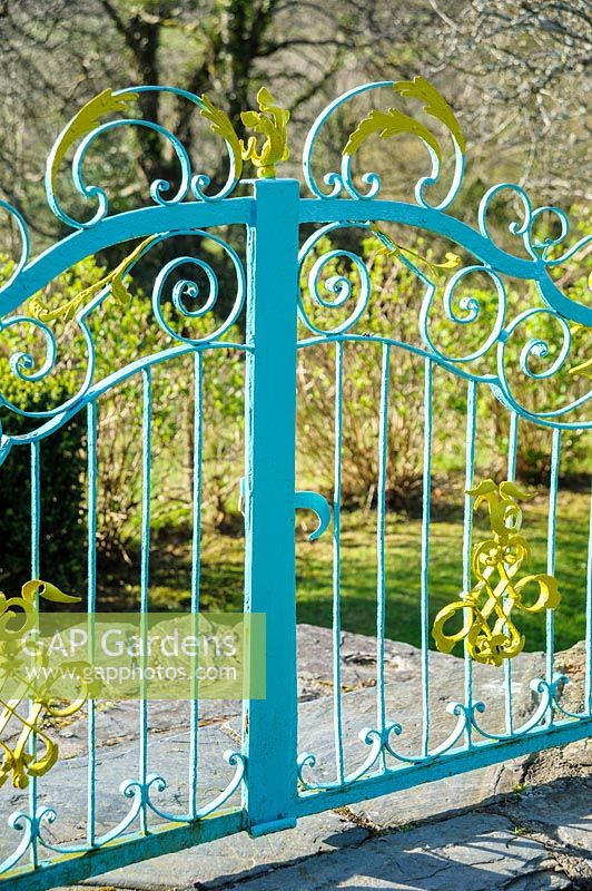 Yellow and turquoise painted metalwork is a characteristic of the garden at Plas Brondanw, Penrhyndeudraeth, Gwynedd, Wales