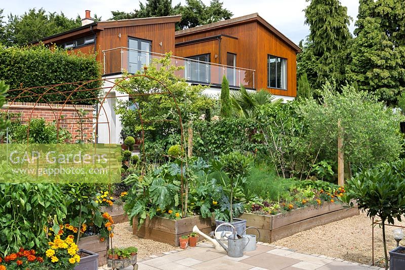 A potager of raised beds, below the original 1920's house, which was redesigned in 2008.