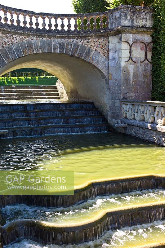An ornamental waterfall flowing from The Water Garden at Chateau de Villandry, Loire Valley, France. 