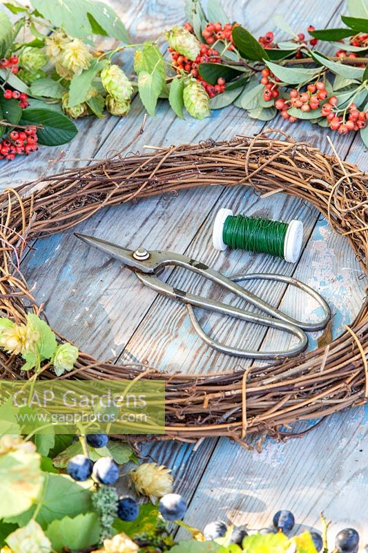 Tools for making autumnal wreath arrangement.