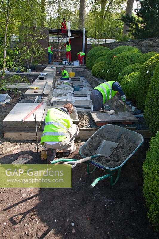Construction of pool in preparation for RHS Chelsea Flower Show. 