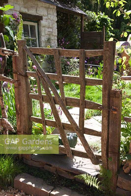 Garden gate made of recycled wood. 'Postcard From Wales' Garden, RHS Chelsea Flower Show