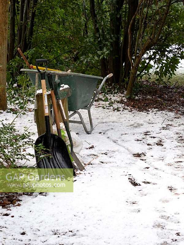 Tools and equipment for snow clearing in garden. 