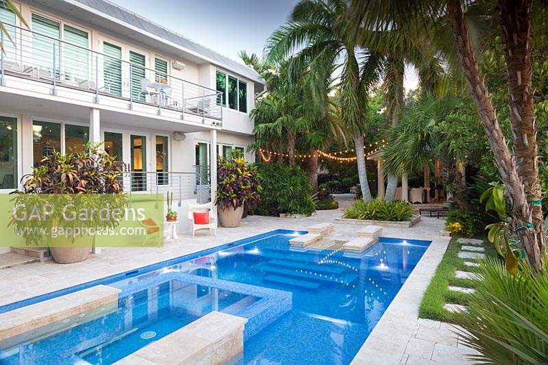 Swimming pool in tropical garden. The Jones Residence, Key West, Florida, USA. Garden design by Craig Reynolds.