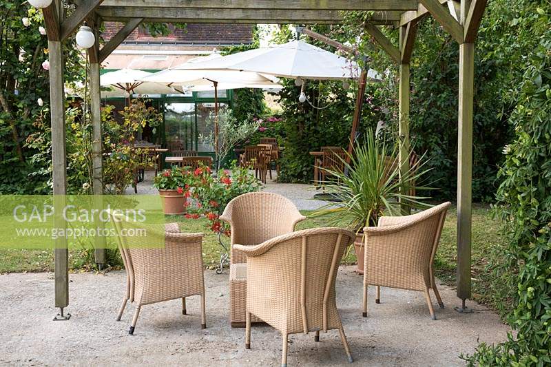 Patio area with outdoor furniture. Garden of the Auberge de Launay, near Amboise, Loire Valley, France