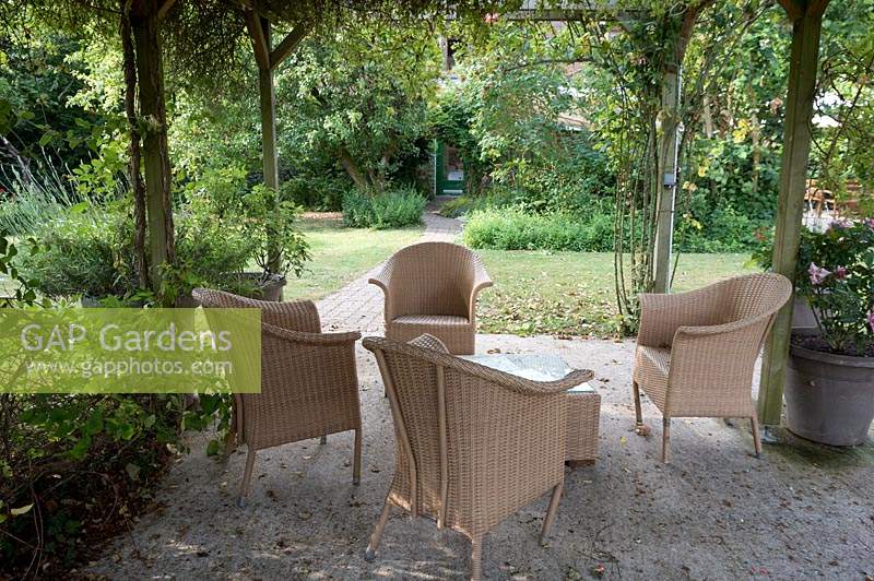 Patio area with outdoor furniture in the Garden of the Auberge de Launay, near Amboise, Loire Valley, France