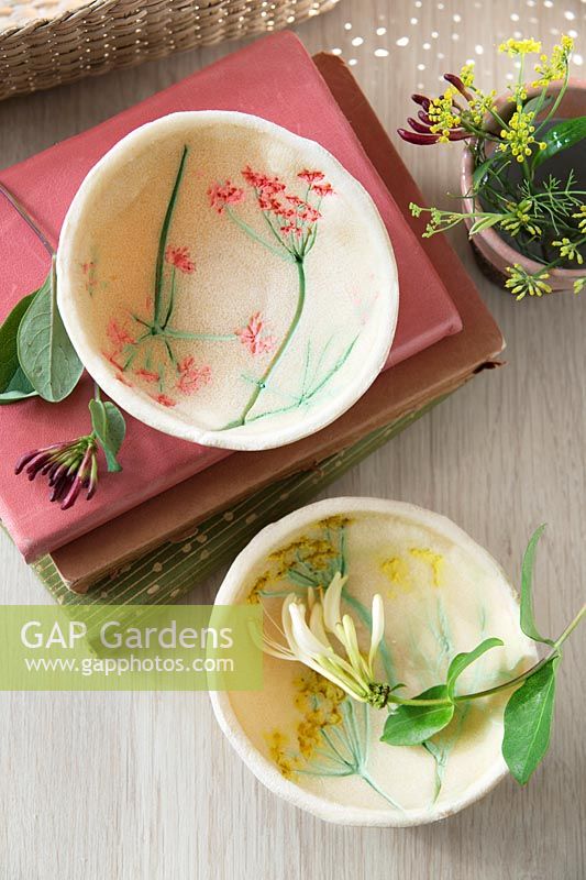 Making small bowls made out of salt dough and painted with flower imprints