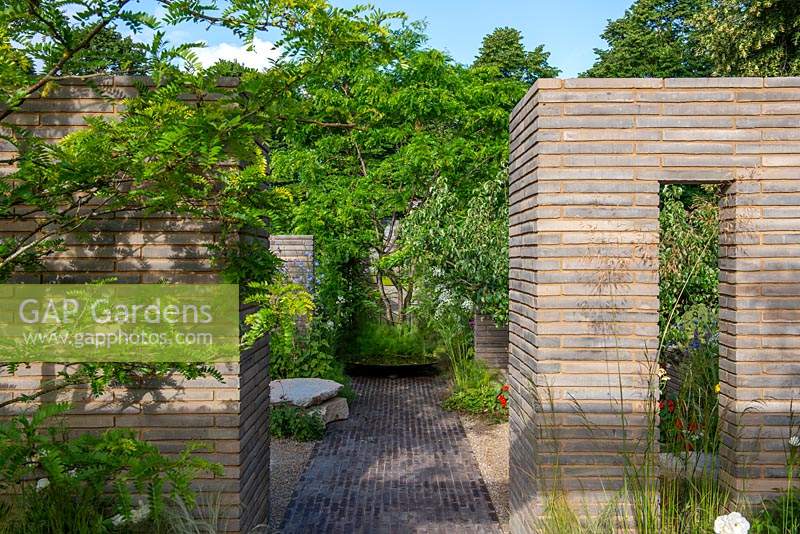 Brick path leading through garden rooms with Belgian brick paver partitions - The RHS Sanctuary Garden, RHS Hampton Court Palace Flower Festival 2019