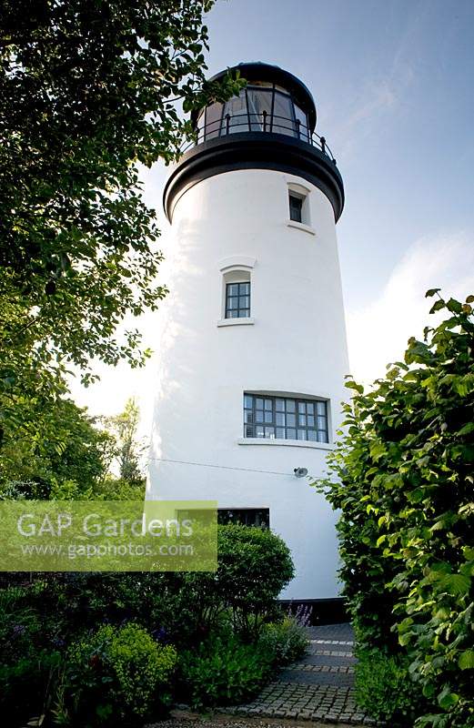 Converted lighthouse and surrounding garden, Winterton-On-Sea, Norfolk, UK. 
