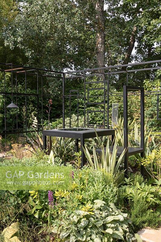 Frontieres du Paradis, Frontiers of Paradise, Festival International des Jardins 2019, Domaine de Chaumont sur Loire, France.  Black metal framework, mixed planting. Between the inner world and the outer world, the house is a boundary and the garden represents a possible paradise for exhausted souls.