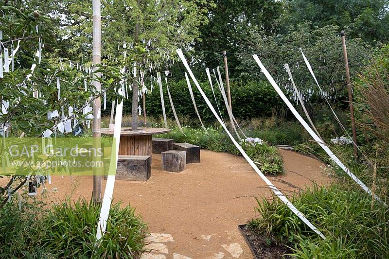 Cultiver les Reves, Grow Your Dreams, Festival International des Jardins 2019, Domaine de Chaumont sur Loire, France. Wishing trees and a tree of life, bearing white ribbons, the symbol of purification in the Old Testament.