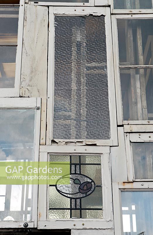Recycled sash windows that make up the giant glasshouse lantern at the Skip Garden, Kings Cross