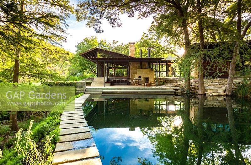 View of stepping stones along swimming pool at Mill Creek Ranch in Vanderpool, Texas designed by Ten Eyck Landscape Inc, July.