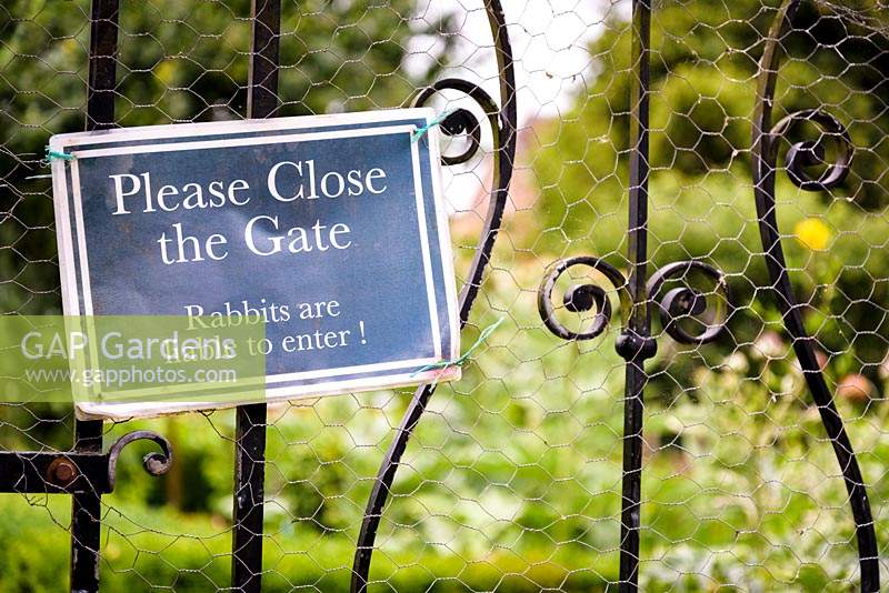 Sign on the gate to the walled kitchen garden at Deans Court, Wimborne, UK.