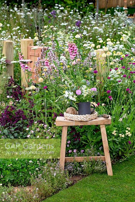 Stool with a vase display of cut flowers - Springwatch Garden - Hampton Court Flower Show 2019 