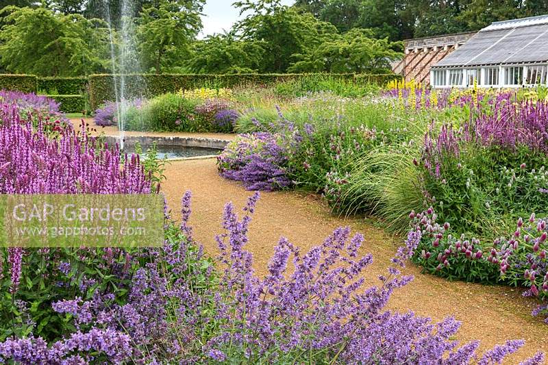 The Perennial Meadow with fountain at Scampston Hall Walled Garden, North Yorkshire, UK. 