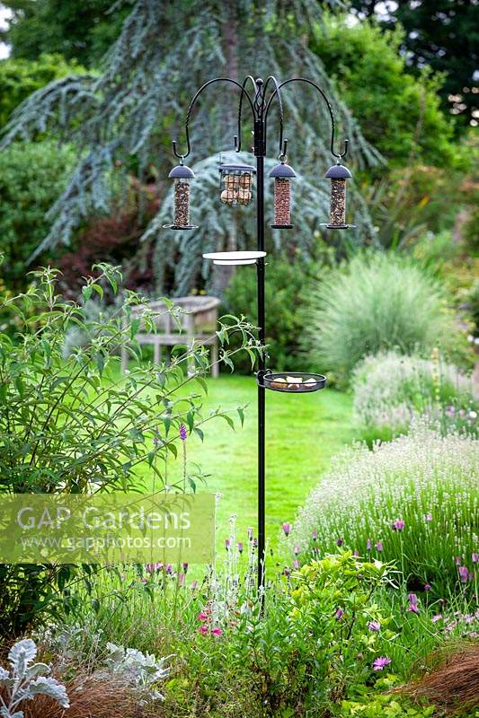 Bird feeder with feeders for nuts, seeds and fat balls