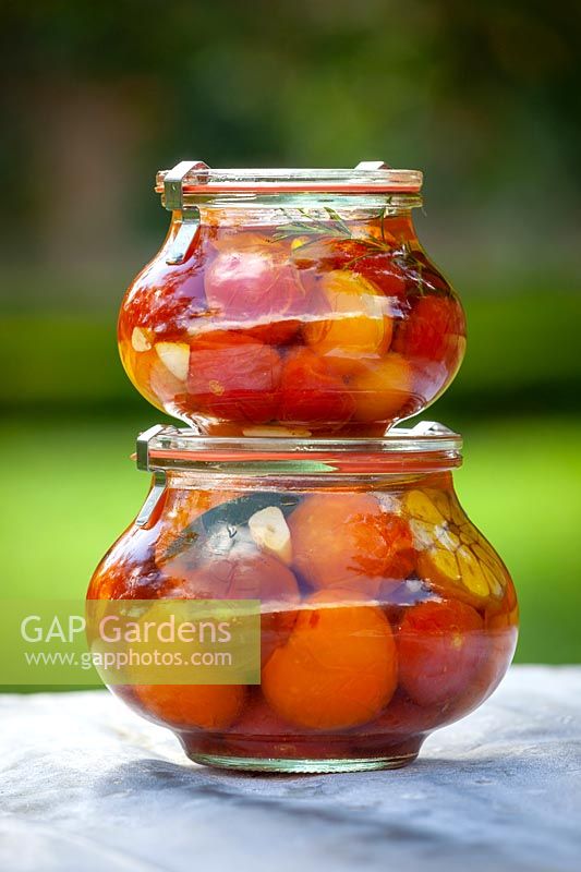 Drowned tomatoes in round jars