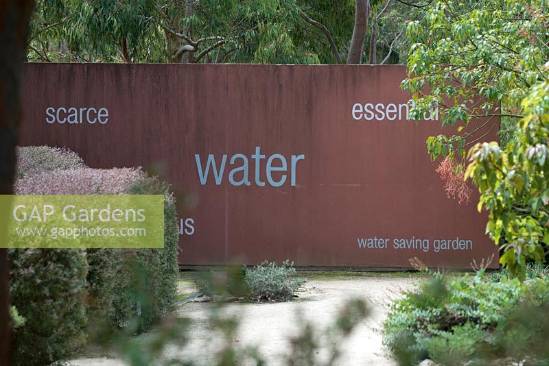Water Saving Garden in Australia with printed words at boundary