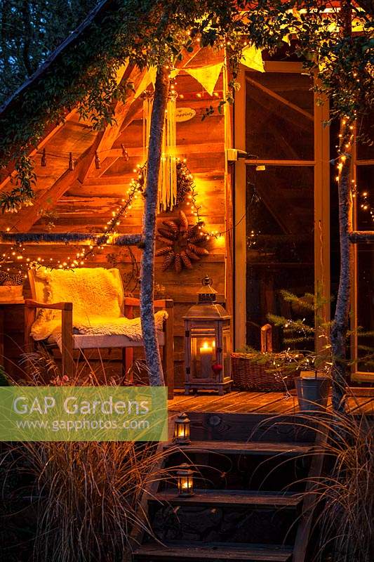 Garden room decorated with fairy lights in December
