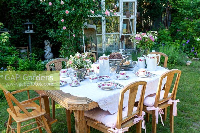 Outdoor table prepared for afternoon tea