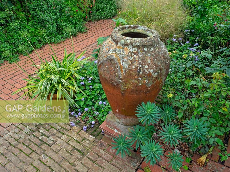 Clay urn and brick path with steps 