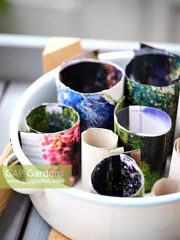 Handmade paper pots in an enamel container