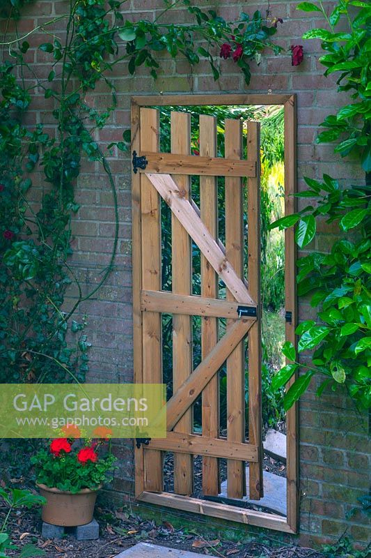 false gateway with mirror in the garden to give the illusion of space  Norfolk 