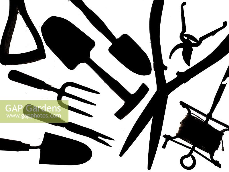 Collection of  garden tools on a white background Secateurs, garden Sieve seed dibber fork loppers and hand Trowels