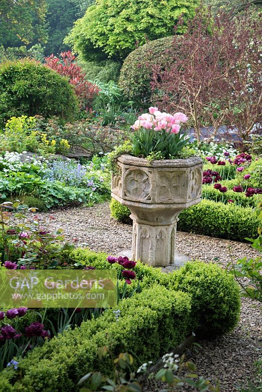 Stone urn in Cotswold Manor House Garden