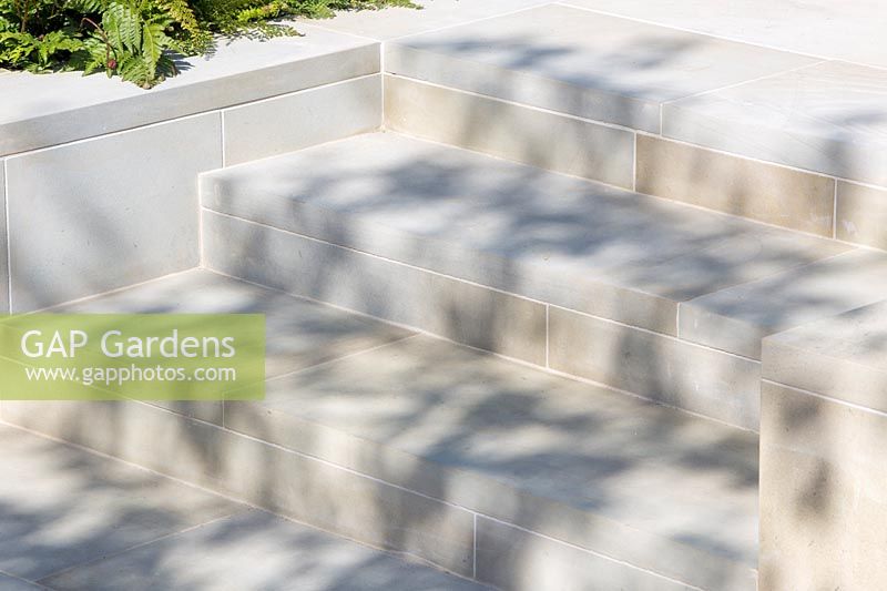 Close up detail of new garden steps made from sawn Yorkshire Yorkstone paving - The Sunken Retreat Garden - Design: Ann Walker for Graduate Gardeners - RHS Malvern Spring Festival, 2016. 