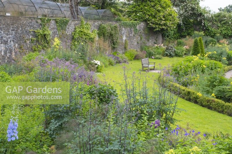 View over flowerbed in The Upper Walled Garden - Designer: Penelope Hobhouse - June