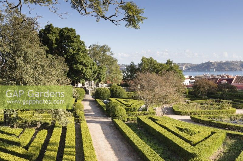 View over the Box Parterre of lines of clipped hedges with view to the River Tajus. Lisbon, Portugal, September.