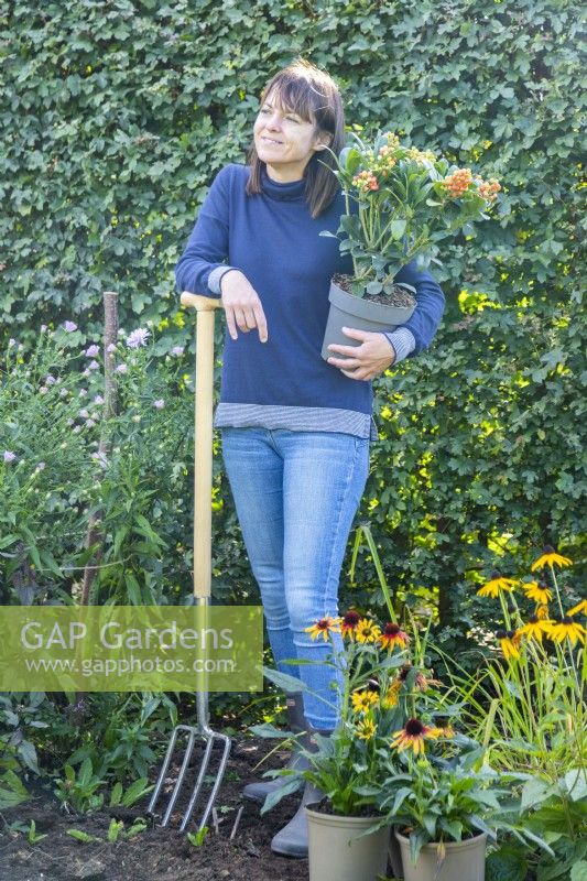 Woman talking whilst gardening